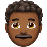 man: medium-dark skin tone, curly hair