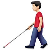 man with white cane: light skin tone