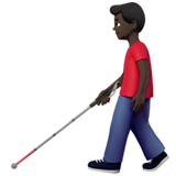 man with white cane: dark skin tone