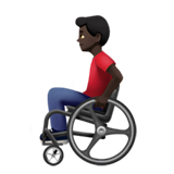 man in manual wheelchair: dark skin tone