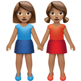 women holding hands: medium skin tone