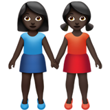 women holding hands: dark skin tone