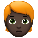 person: dark skin tone, red hair