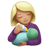 woman feeding baby: medium-light skin tone