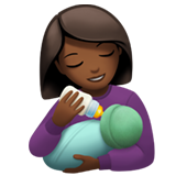 woman feeding baby: medium-dark skin tone