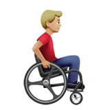 man in manual wheelchair facing right: medium-light skin tone