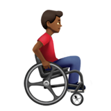 man in manual wheelchair facing right: medium-dark skin tone