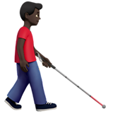 man with white cane facing right: dark skin tone