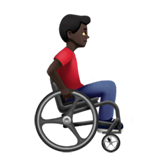 man in manual wheelchair facing right: dark skin tone