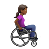 woman in manual wheelchair facing right: medium-dark skin tone