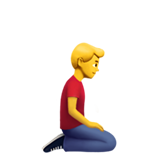 man kneeling facing right