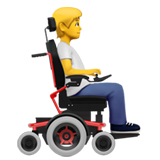 person in motorized wheelchair facing right