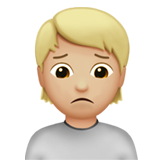 person frowning: medium-light skin tone