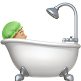 person taking bath: medium-light skin tone