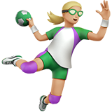 woman playing handball: medium-light skin tone